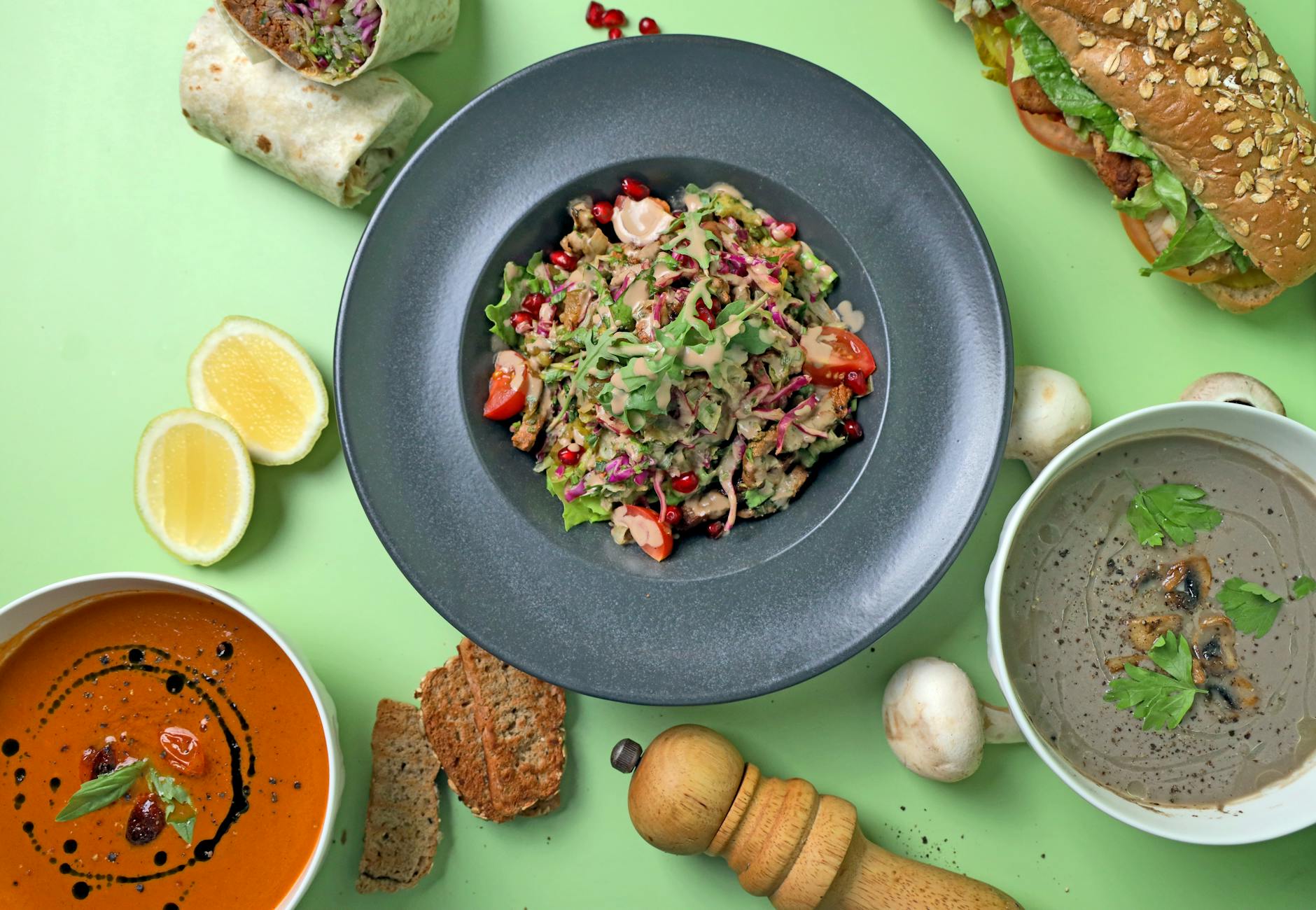 Mushroom Foraging: Ultimate Guide to Discovering Delicious Varieties A vibrant assortment of vegetarian dishes arranged on a green surface, showcasing a variety of textures and flavors.